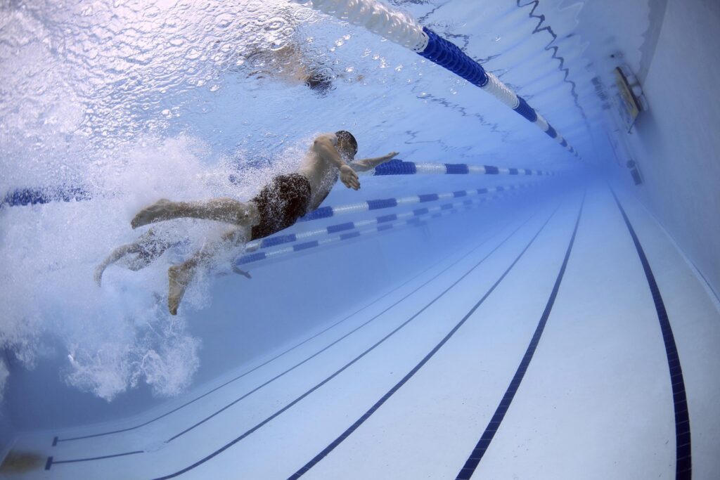 person swimming in a pool
